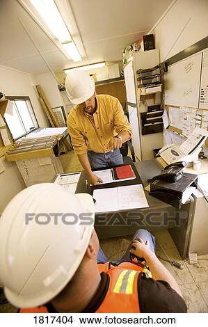 Trades workers in an office View Large Photo Image Picture - Trades workers in an office. Fotosearch