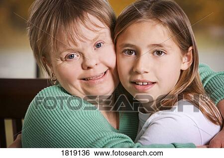 Two girls hugging View Large Photo Image Stock Photograph - Two girls hugging. Fotosearch