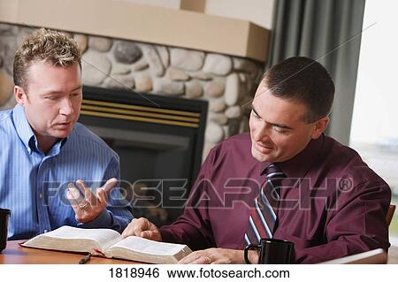 Two men studying Bible View Large Photo Image Stock Photograph - Two men studying Bible. Fotosearch