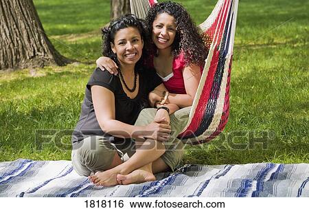 Stock Photograph - Two Women at the park. Fotosearch