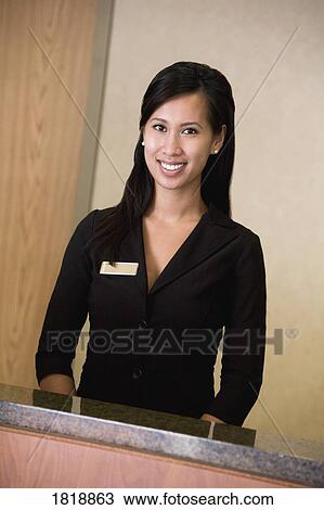 Stock Image - Woman behind counter. Fotosearch