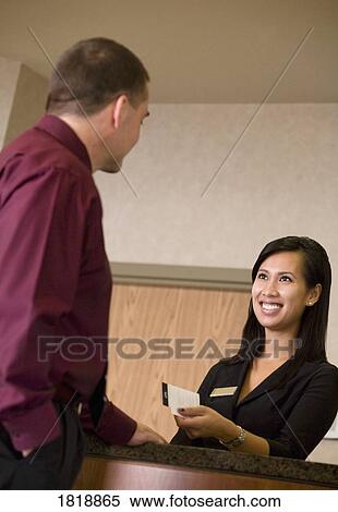 Stock Photography - Woman behind counter. Fotosearch