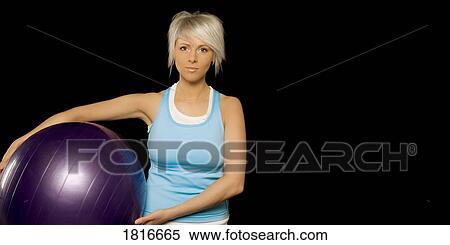 Woman holding exercise ball View Large Photo Image Stock Photography - Woman holding exercise ball. Fotosearch