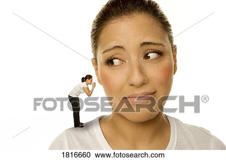 Stock Image - Woman listening to a voice. Fotosearch