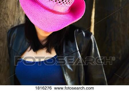 Woman wearing pink cowboy hat View Large Photo Image Stock Photograph - Woman wearing pink cowboy hat. Fotosearch