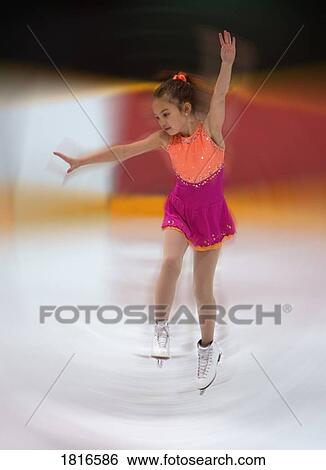 Young girl figure skating View Large Photo Image Stock Photograph - Young girl figure skating . Fotosearch