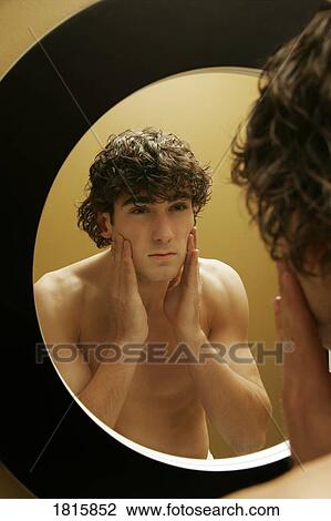 Young man preparing to go out View Large Photo Image Stock Image - Young man preparing to go out. Fotosearch