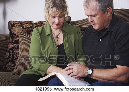 A couple praying View Large Photo Image Stock Photography - A couple praying. Fotosearch