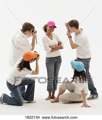 A group of teens taking pictures View Large Photo Image Picture - A group of teens taking pictures. Fotosearch