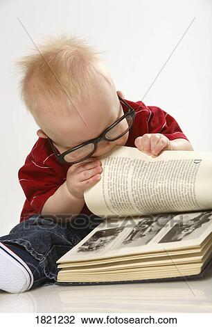 Baby chewing on a book View Large Photo Image Stock Image - Baby chewing on a book. Fotosearch