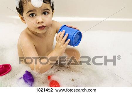Baby in a bubble bath View Large Photo Image Stock Image - Baby in a bubble bath . Fotosearch