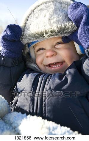 Baby in the snow View Large Photo Image Stock Photograph - Baby in the snow. Fotosearch
