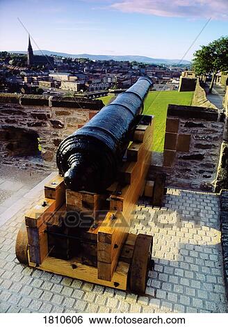 Stock Photograph - Cannon on a city wall, Derry City, Ireland. Fotosearch