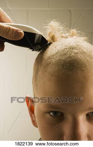 Child getting a buzz cut View Large Photo Image Stock Photo - Child getting a buzz cut. Fotosearch