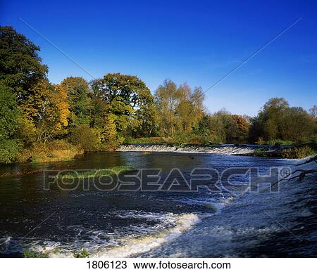 Stock Image - Co Carlow, weir at the site of Ireland's first H. E. P. at Millford Mills. Fotosearch