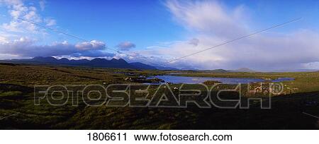 Stock Image - Co Galway, Connemara, bog with the Twelve Bens in the distance, Ireland. Fotosearch