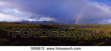 Stock Image - Co Galway, Connemara, bog with the Twelve Bens in the distance, Ireland. Fotosearch