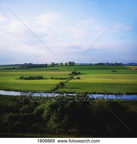 Stock Photo - Co Meath, River Boyne with Newgrange in the distance, Ireland. Fotosearch