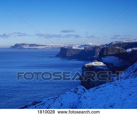 Dunluce Castle in winter, Co Antrim, Ireland View Large Photo Image Stock Photo - Dunluce Castle in winter, Co Antrim, Ireland. Fotosearch