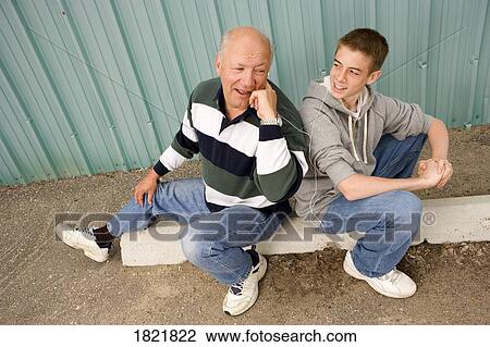 Grandpa and grandson listening to music View Large Photo Image Stock Image - Grandpa and grandson listening to music. Fotosearch