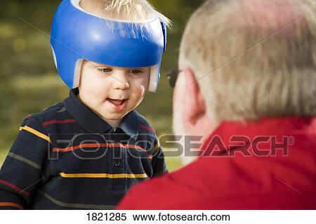 Grandpa playing with grandson View Large Photo Image Stock Photography - Grandpa playing with grandson. Fotosearch