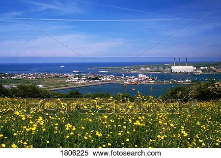 Stock Photography - Larne Harbour ferry terminals and power station, County Antrim, Northern Ireland. Fotosearch