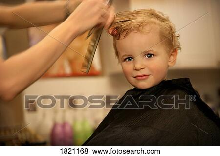 Little boy getting a haircut View Large Photo Image Stock Photo - Little boy getting a haircut . Fotosearch