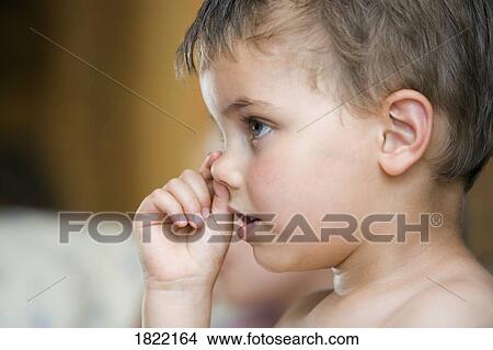 Little boy picking nose View Large Photo Image Picture - Little boy picking nose . Fotosearch