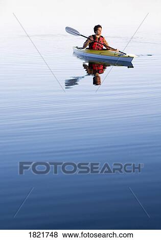 Stock Photo - Man in a kayak. Fotosearch