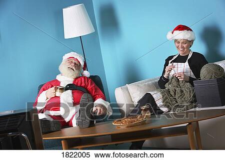 Stock Photography - Santa and Mrs. Claus relaxing. Fotosearch