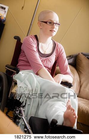 Stock Photography - Sick girl in wheelchair. Fotosearch