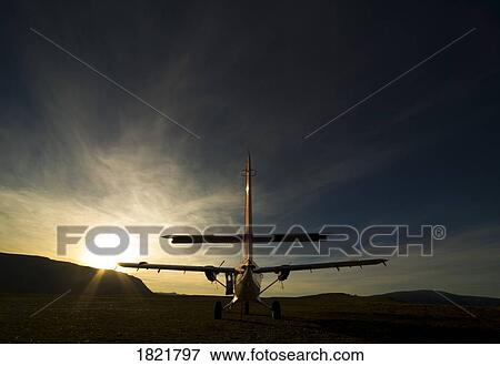 Stock Photo - Small aircraft silhouette. Fotosearch