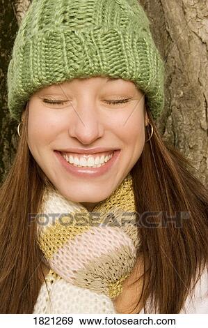 Stock Photo - Smiling woman with toque and scarf. Fotosearch