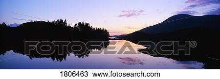 Stock Image - Sunset, Ballinahinch Lake, Connemara, Co Galway, Ireland. Fotosearch