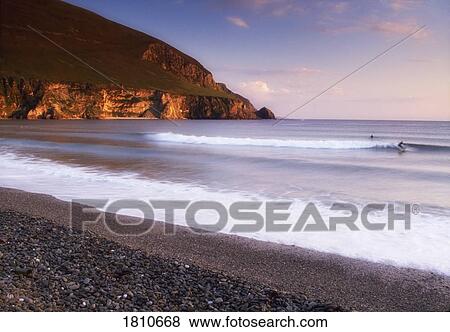 Stock Photo - Surfers in Trawmore Bay, Achill Island, Co Mayo, Ireland. Fotosearch