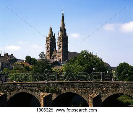 Stock Photography - The uneven spires of Omagh's Sacred Heart Church, Co Tyrone, Ireland. Fotosearch