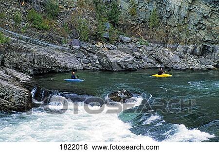 Two people kayaking on Kootenai Falls, Montana, USA View Large Photo Image Stock Photo - Two people kayaking on Kootenai Falls, Montana, USA. Fotosearch