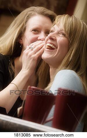 Two women sharing secrets View Large Photo Image Stock Photography - Two women sharing secrets. Fotosearch