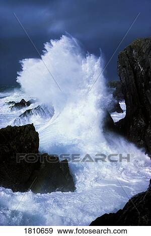Stock Photo - Waves crashing on rocks. Fotosearch