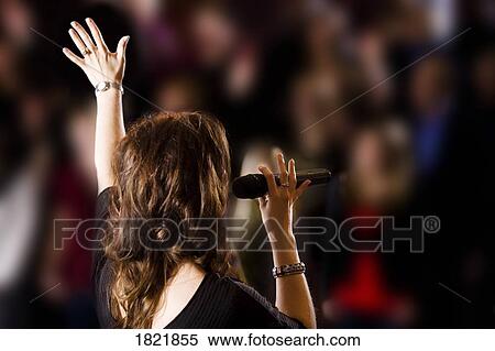 Stock Photography - Woman on the stage. Fotosearch