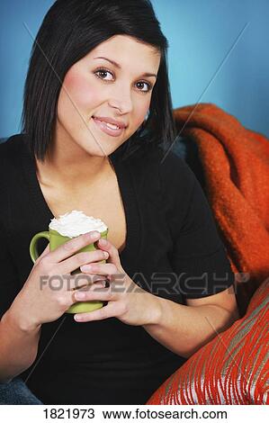 Stock Image - Woman with beverage. Fotosearch
