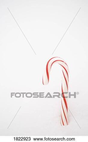 A candy cane in the snow View Large Photo Image Stock Image - A candy cane in the snow. Fotosearch