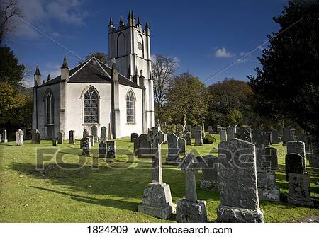 Stock Photo - A church and cemetery in Scotland. Fotosearch