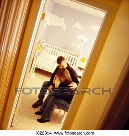 A couple in a baby room View Large Photo Image Picture - A couple in a baby room. Fotosearch
