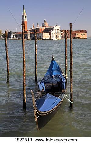 A gondola with San Giorgio Maggiore in the background, Venice, Italy View Large Photo Image Stock Photo - A gondola with San Giorgio Maggiore in the background, Venice, Italy. Fotosearch