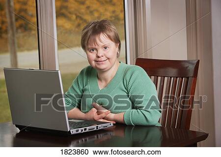 A woman with a laptop View Large Photo Image Stock Image - A woman with a laptop. Fotosearch