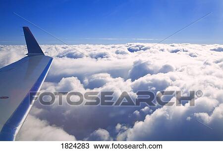 Aircraft above the clouds View Large Photo Image Stock Image - Aircraft above the clouds . Fotosearch