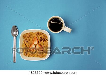 Bowl of cereal and cup of coffee View Large Photo Image Stock Photo - Bowl of cereal and cup of coffee. Fotosearch