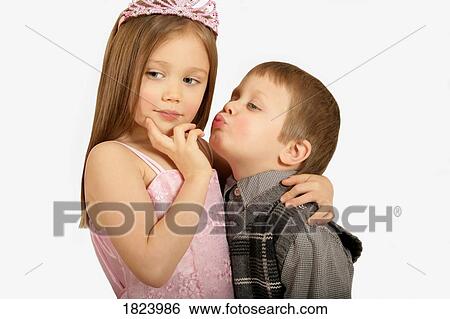 Stock Photograph - Boy trying to kiss princess. Fotosearch