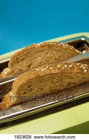 Bread in a toaster View Large Photo Image Stock Photo - Bread in a toaster. Fotosearch